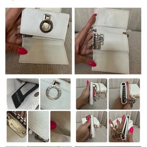 Bvlgari white leather key holder paired with removable off brand purse and chain
